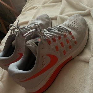 Orange Nike shoes